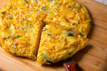 Traditional Spanish omelette with zucchini and potatoes.