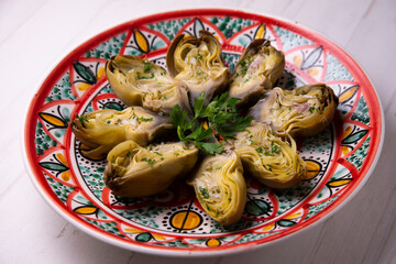 Artichokes baked in the oven and served in a traditional dish from southern Spain of the Andalusian...