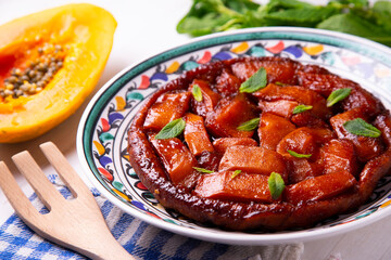 Papaya tarte tatin. Traditional French recipe without apple but with tropical fruit.