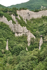 Pyramids of Zone Rock formations, also known as fairy chimneys, earth pyramids, hoodoos Monument rocks (Chalk Pyramids) of Zone at (ISEO) lake Lombardy Italy.