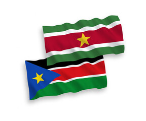 Flags of Republic of Suriname and Republic of South Sudan on a white background