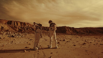 Astronauts discussing base location on Mars