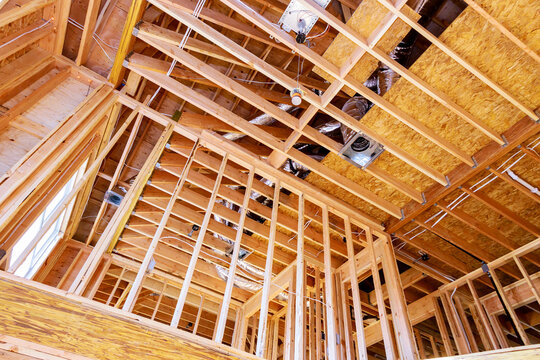 Frame house roof of house attic under construction frame wooden beams