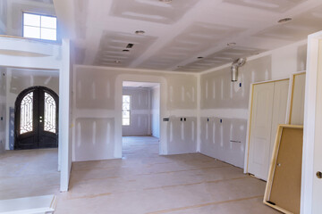 Fototapeta na wymiar A new home interior wooden stacker doors a wait installation