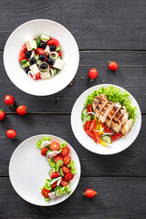 various salads menu page salad appetizer snack vegetable, greek salad, grilled chicken, organic dish on the table healthy meal copy space food background rustic keto or paleo diet 
