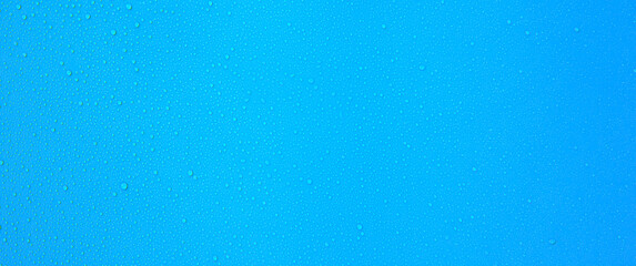 Moisture water droplets or steam or raindrops on window glass or wall for nature wallpaper background and texture.