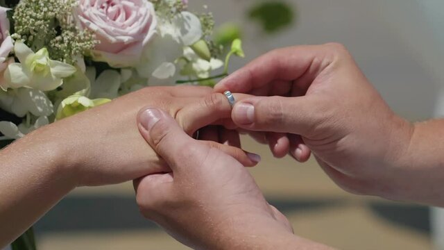 Wedding  exchanging  ring with bride for ceremony , silver diamond ring.