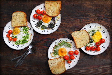 Healthy breakfast . Freshly made, delicious meal of eggs and vegetables. Fried eggs with herbs, leek, onion, kale, dill