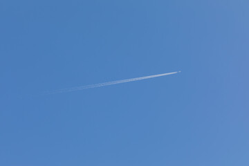 Contrail in blue sky