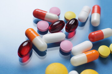 Colorful of tablets and capsules pill in blister packaging arranged with beautiful pattern with flare light. Pharmaceutical industry concept. Pharmacy drugstore. Antibiotic drug resistance.