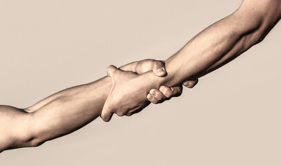 Two hands, helping arm of a friend, teamwork. Rescue, helping gesture or hands. Close up help hand....