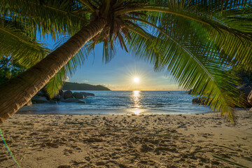 Obraz na płótnie Canvas sunset at tropical beach anse lazio on praslin on the seychelles