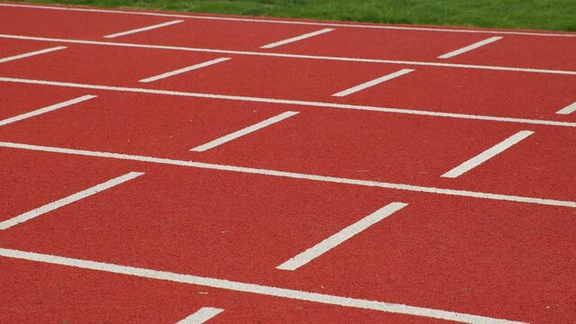 Red running track on stadium