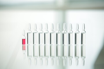Vaccine medical vials on glass table in clinics