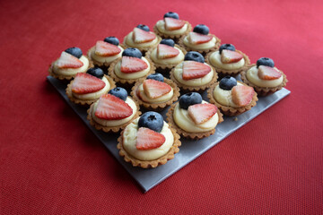 Blueberry and strawberry tart cakes are a favourite of many people who visit a cake shop.