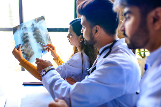 indian doctors are checking examining chest x-ray film
