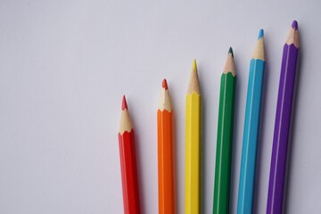 Color pencils on white paper. Concept  rainbow color for lgbtqai communities in pride month celebrate in June 2021