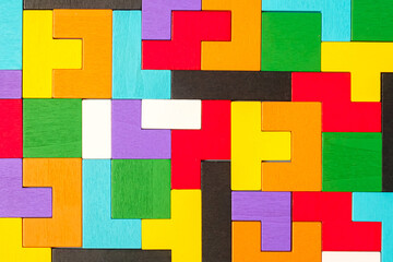 geometric shape block with colorful wood puzzle piece background. logical thinking, business logic, Conundrum, decision, solutions, rational, mission, success, goals and strategy concepts