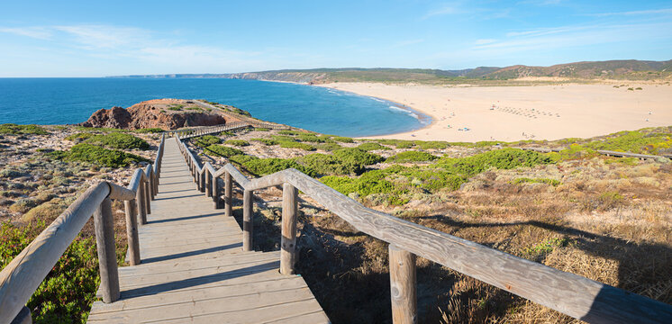 wooden boardwalk down to Bordeira Beach, surfer paradise, algarve Portugal - Powered by Adobe
