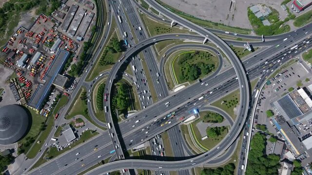 Busy multilevel junction near industrial buildings