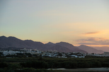 Mountains and forests around the capital Muscat in the Sultanate of Oman during a sunset