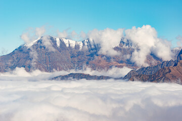 Fototapeta na wymiar Clouds above the mountains at autumn time.
