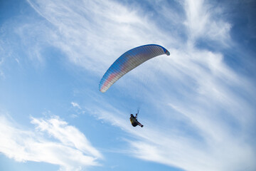 Paragliding over sea with beautiful blue sky background at Phuket,Thailand. soft socus.
