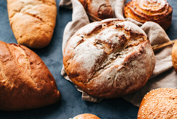 Different types of fresh bread and bakery on the table.