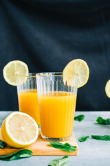 Fresh lemonade with mint and lemon in glass with ice, summer drink.