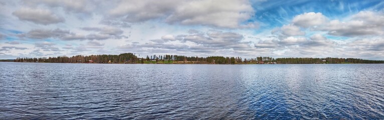 Panorama of Swedish Lake with the small town Petiktrask