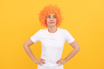 looking up. funny girl in orange wig. april fools day. happy lady having fun. going crazy.