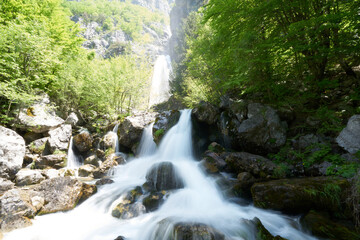 Waterfall in the mountains in Theth in the Albanian alps