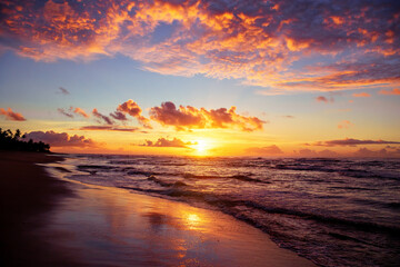 Fototapeta na wymiar Sunset in beach of Brazil, sunrise in coastline of Salvador Bahia sand, sea and sun