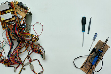 Disassembled power supply of a stationary personal computer on an isolated background. Repair of computer equipment.