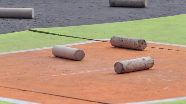 Russian traditional folk game GORODKI. The bat, Bita knocks the figure out of the sticks. High quality FullHD footage