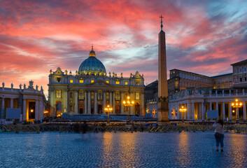 Papal Basilica of Saint Peter and St. Peter's Square in Vatican at sunset, Rome, Italy. Architecture and landmark of Rome. Postcard of Rome