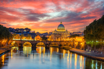 Naklejka na ściany i meble Sunset view of Basilica St Peter, bridge Sant Angelo and river Tiber in Rome. Italy. Architecture and landmark of Rome. Postcard of Rome