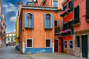 Narrow street in Venice, Italy. Architecture and landmark of Venice. Cozy cityscape of Venice.