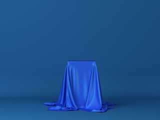 Cube covered with piece of cloth