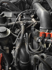Fototapeta na wymiar Modern car engine in dust under the hood