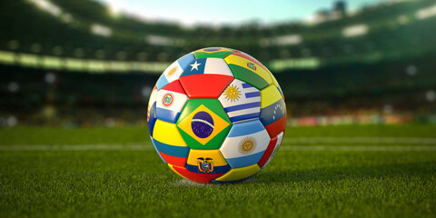 Soccer Football ball with flags of south america countries on the grass of football stadium. America championship 2021.