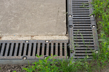 Street drainage system at the foundation of the house. Wastewater drainage.