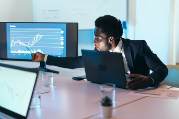 Business stock trader man working on crypto currency markets with blockchain technology -...