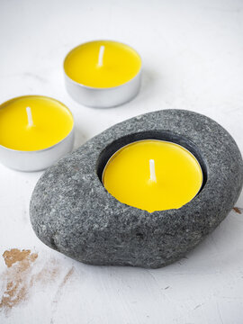 Citronella anti-mosquito candles on white rustic background