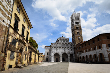 view of the cathedral of Lucca, famous town in the countryside of tuscany (Italy). The church and the square are dedicated to saint martin of tours - 438998758