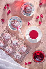 Top view of cookies with flower tea and raspberry jam, flat lay. Cookies on a metal cooling rack