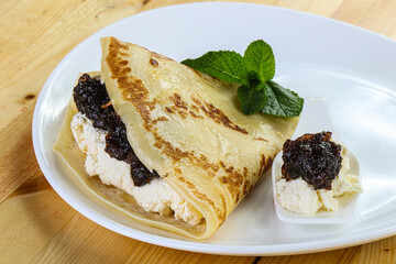 Pancake with cottage cheese and jam