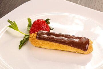 Sweet tasty eclair with chocolate