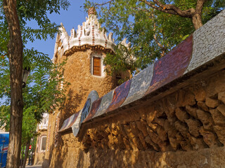 Antoni Gaudi wall and tower architectural elements in Park Guell, Barcelona, Catalonia, Spain - 439002378