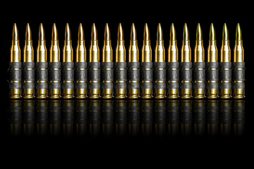 Bullet chain ammunition isolated on black background
